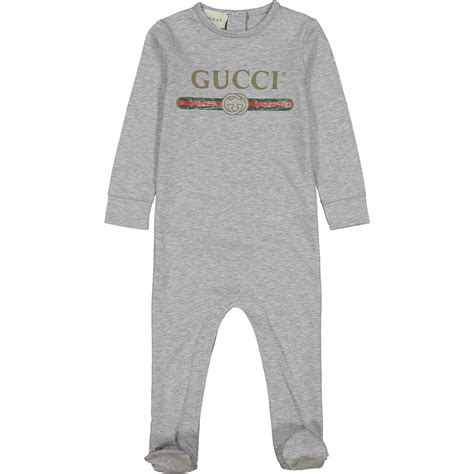 gucci baby onesie.